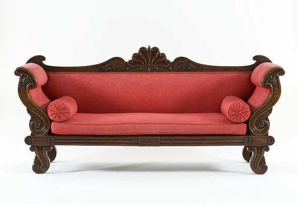 Sofa. Mahogany sofa carved with scrolls and an anthemion cresting