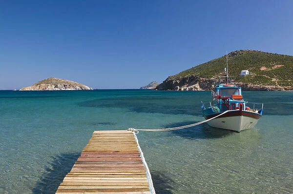 Greece, Dodecanese Islands, Patmos, Kampos, Shore view with small boat  /  Livadi Geranos