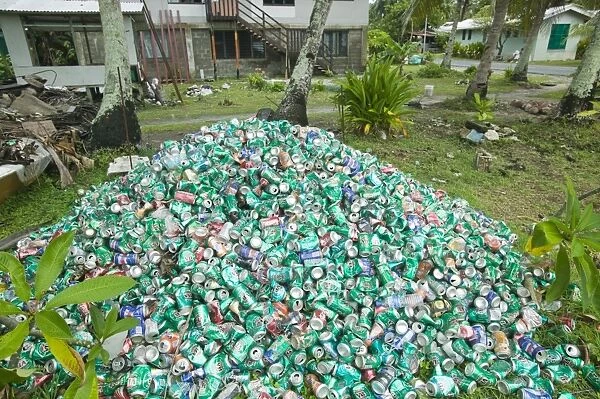 Beer cans piled up in a garden on Funafuti atol Tuvalu