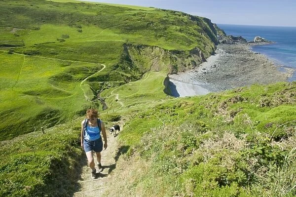 A women on the South West Coast Path near Hartland Point Devon UK