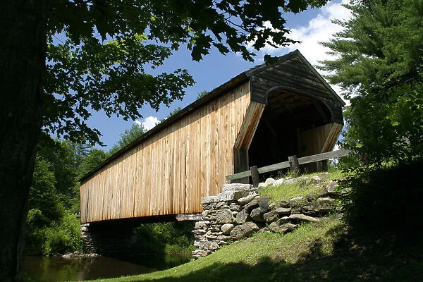 20074119. USA New Hampshire Newport Corbin Bridge wooden covered bridge going over water