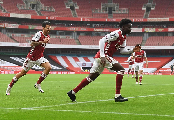 LONDON, ENGLAND - OCTOBER 04: Bukayo Saka celebrates scorign the 1st Arsenal goal during the Premier League match