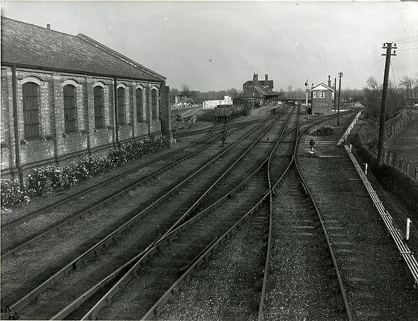 Mildenhall, view into terminal station, goods shed, with border of roses on the left