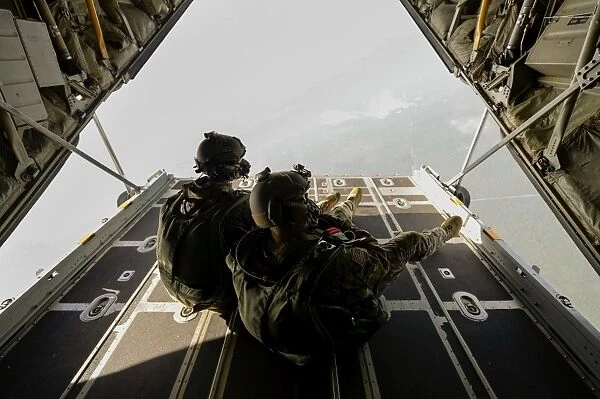 U. S. Army Green Berets wait to jump out of a C-130H3 Hercules