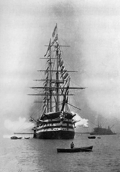 HMS Duke of Wellington firing a Royal Salute as flagship at Portsmouth, Hampshire, 1896. Artist: Symonds & Co