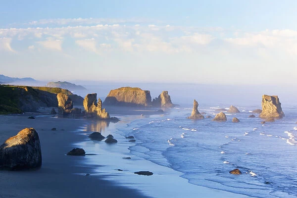 Morning Light Adds Beauty To Fog Covered Rock Formations At Bandon State Park; Bandon, Oregon, United States of America