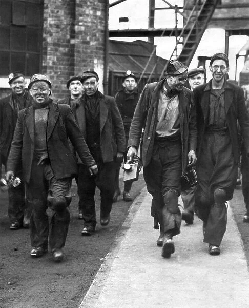 Beaming miners leaving Ravensworth Colliery near Birtley after a Saturday morning shift