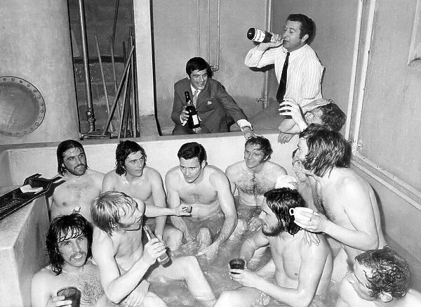 Birmingham City players celebrate in the bath team with manager Freddie Goodwin sitting