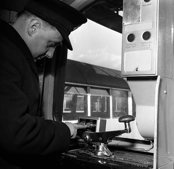 A guard at the controls of one of London Underground