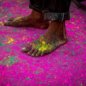 Mans bare feet during the color pigment throwing festival, Holi Festival, Vrindavan