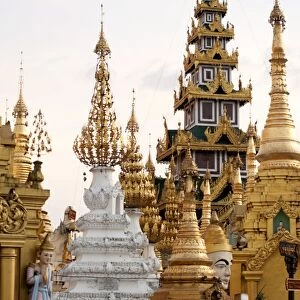 Shrines and pagodas at Shwedagon Pagoda, 2500 year old sacred Buddhist site, covered in gold