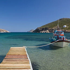 Greece, Dodecanese Islands, Patmos, Kampos, Shore view with small boat / Livadi Geranos