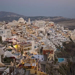 Europe, Greece, Dodecanese, Santorini: View of Fira as the sun sets