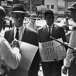 Police officers arrest Medgar Evers and NaCP executive secretary Roy Wilkins, while protesting outside a Woolworths Store in Jackson, Mississippi, 1 June 1963