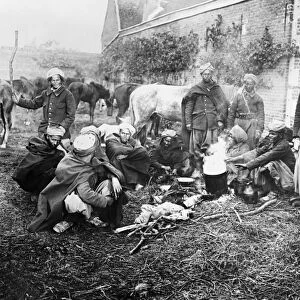 WWI: SPAHIS, 1914. Moroccan spahis around a fire, probably in Ribecourt, France