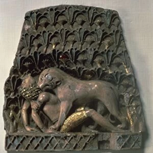 Ivory furniture ornament depicting lioness attacking an African boy, from Nimrud, Iraq