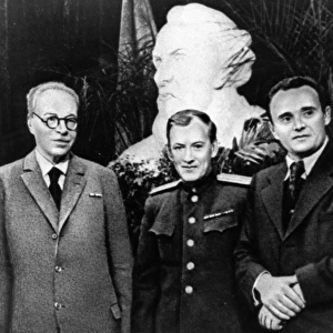 Scientist a, blagonravov and rocket designers mikhail tikhonravov and sergei korolev during celebrations on the occasion of the 90th birthday of konstantin tsiolkovsky, the founder of cosmonautics, a reproduction from designer of spaceships by a, romanov, gospolitizdat publishing house, 1968