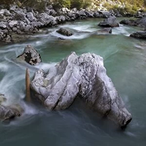 Rock in the turquoise Soca river, Soca Valley near Bovec, Triglav National Park, Slovenia, Europe