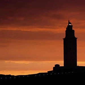 Silhouette of Hercules Tower at orange sunset
