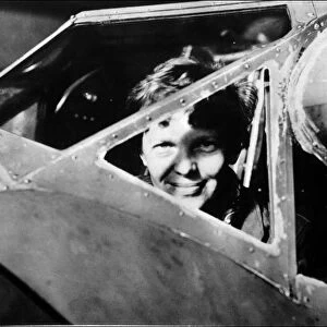 Amelia Earhart looking through the cockpit window