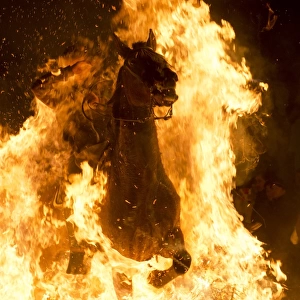 Horseman Jumping a Bonfire during Luminarias