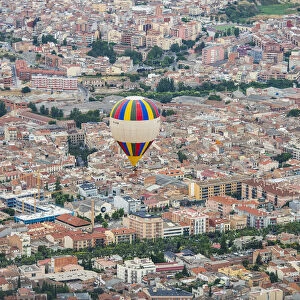A hot-air balloon flies over Igualada, near Barcelona, during the 21th European Balloon Festival