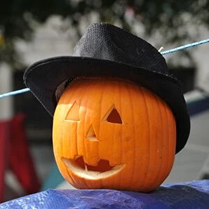A pumkin wearing a hat sits atop an Occupy DC tent in McPherson Square on October 31