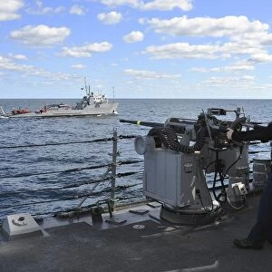 Gunneras Mate mans the MK-38 25mm machine gun aboard USS Porter