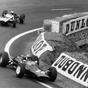 1965 French Grand Prix. Charade, Clermont-Ferrand, France. 25-27 June 1965. Innes Ireland (Lotus 25), retired leads Bruce McLaren (Cooper T77), retired, action. World Copyright - LAT Photographic. Ref: B/W Print