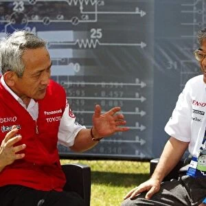 Formula One World Championship: Tsutomu Tomita Chairman of Toyota Racing and Toyota Team Principal talks with Tetsuo Hattori Toyota Motor Corporation