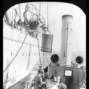 boarding a ship in a basket from steamer