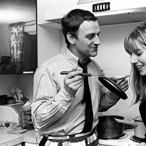 Actor John Thaw at home with wife Sally cooking 1966