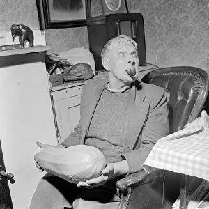 Archie Haffenden seen here enjoying his pipe and holding his prize marrow Circa