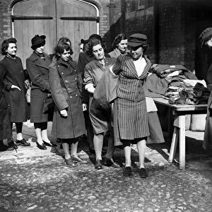 Army Class ATS girls trying on outfits. March 1942 P010189