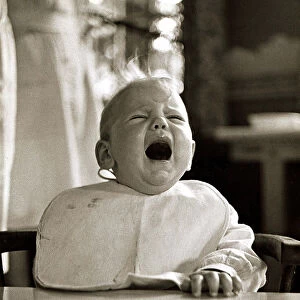 Crying baby with mouth open 1947