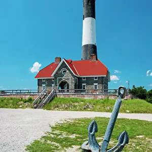 USA, New York, Long Island, anchor in front of Fire Island Lighthouse and blue sky