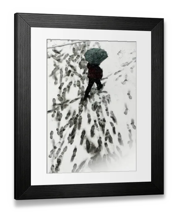 Framed Print : A man walks with his umbrella under snow in downtown Belgrade, 06 March 2006