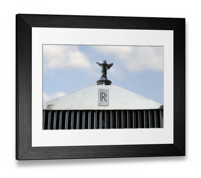 Framed Print : An original hood ornament adorns the grill of a 1952 Rolls Royce during an antique