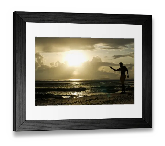 Framed Print : A man gestures on a beach in Dar es Salaam on April 26, 2014, as Tanzania celebrates Framed Print : A man gestures on a beach in Dar es Salaam on April 26, 2014, as Tanzania celebrates