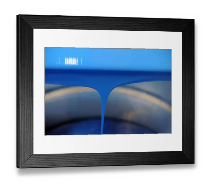 Framed Print : Blue paint is poured into a bucket in a workshop at the Raphael-Isabey-Sennelier Framed Print : Blue paint is poured into a bucket in a workshop at the Raphael-Isabey-Sennelier