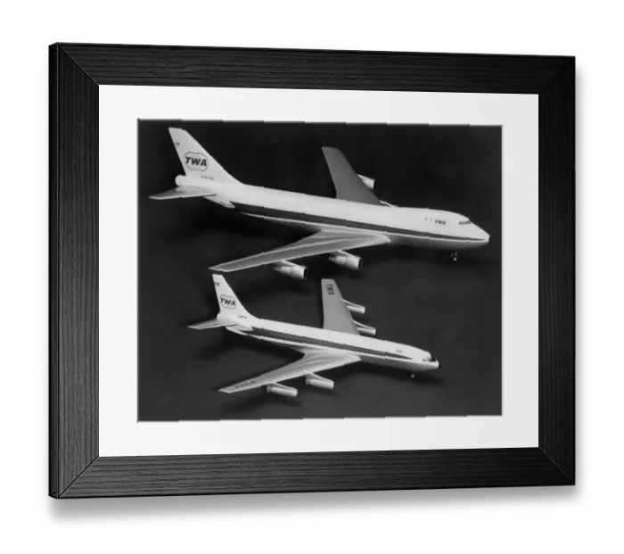 Framed Print : Two models of Boeing planes are compared : Boeing 747 (top) is two and a half times