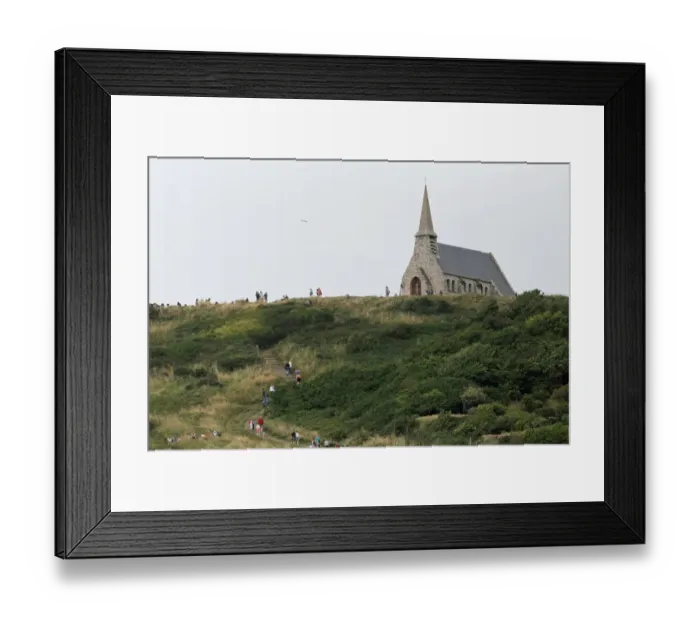 Framed Print : The Notre-Dame-de-la-Garde chapel, perched on the cliffs of Etretat, is pictured on July 20 Framed Print : The Notre-Dame-de-la-Garde chapel, perched on the cliffs of Etretat, is pictured on July 20