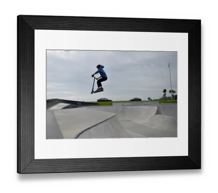 Framed Print : A boy rides a scooter in a skate park on October 7, 2016 in Saint-Nazaire, western France Framed Print : A boy rides a scooter in a skate park on October 7, 2016 in Saint-Nazaire, western France
