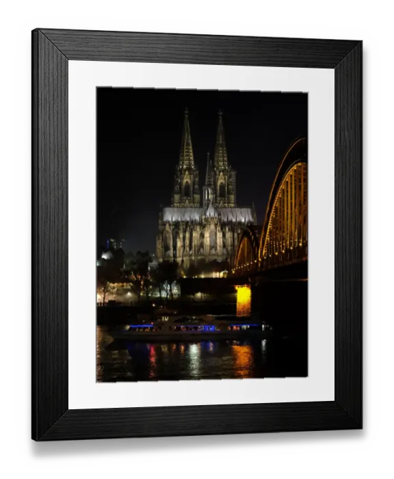 Framed Print : The Hohenzollern bridge is seen in front of the Cologne cathedral on December 31 Framed Print : The Hohenzollern bridge is seen in front of the Cologne cathedral on December 31