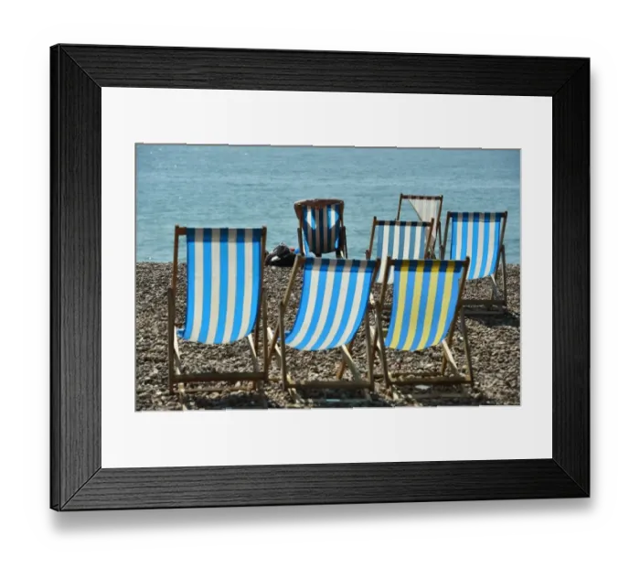 Framed Print : Britain-Weather-Offbeat-Deckchairs Framed Print : Britain-Weather-Offbeat-Deckchairs