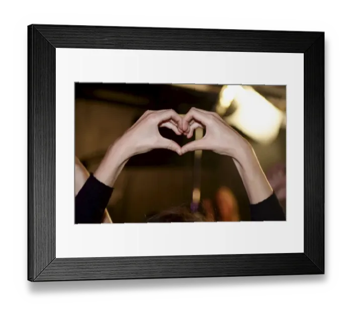 Framed Print : A heart shape is formed by a participant of the Feminist Initiative election night