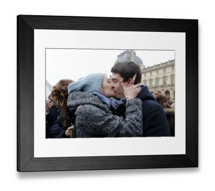 Framed Print : A couple kisses during a flashmob in Paris on February 14, 2014, to mark the launch