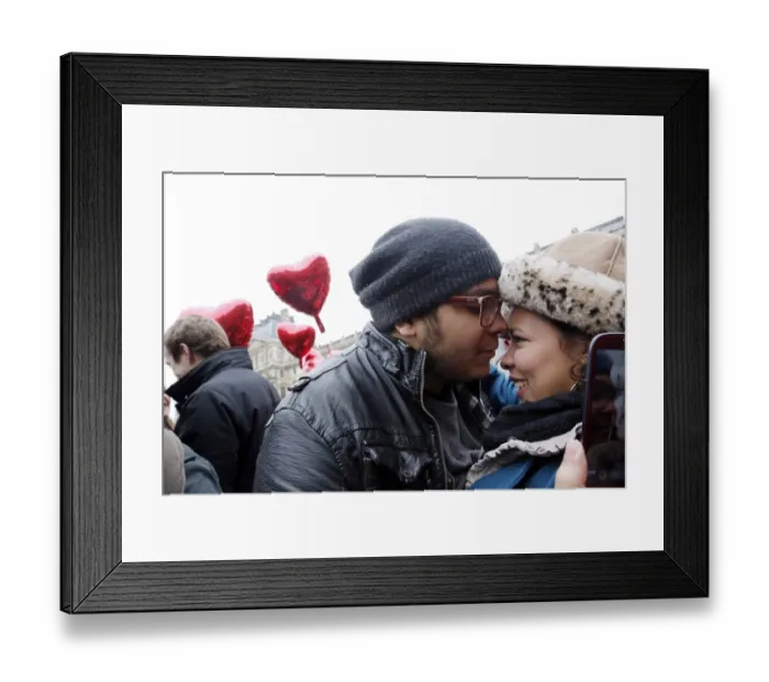 Framed Print : A couple takes a selfie with their mobile phone during a flashmob near