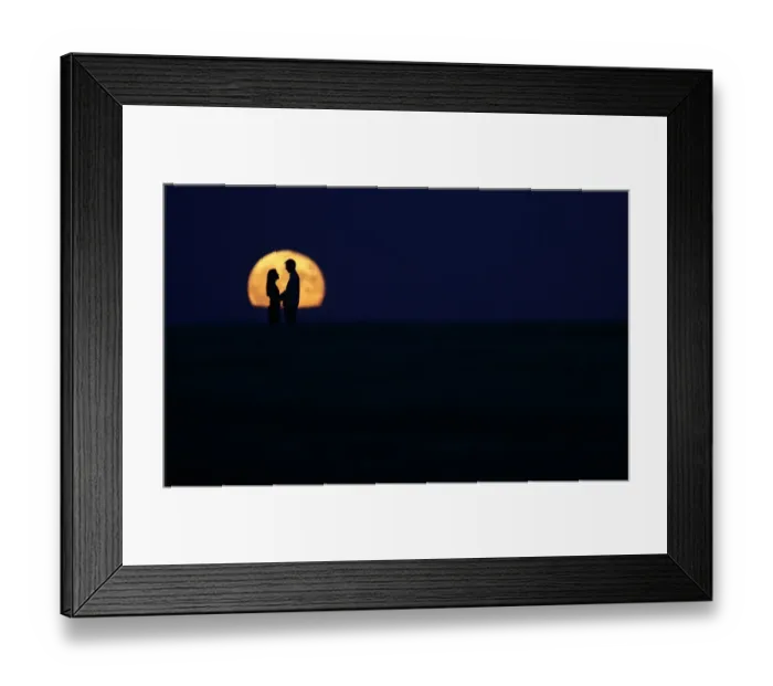 Framed Print : A couple stand in front of the full moon in Burgos on September 9, 2014 Framed Print : A couple stand in front of the full moon in Burgos on September 9, 2014