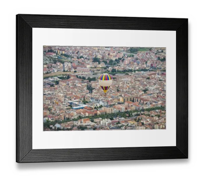 Framed Print : A hot-air balloon flies over Igualada, near Barcelona, during the 21th European Balloon Festival